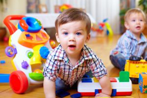 bigstock-curious-baby-boy-studying-nurs-42451435-e1409850135499